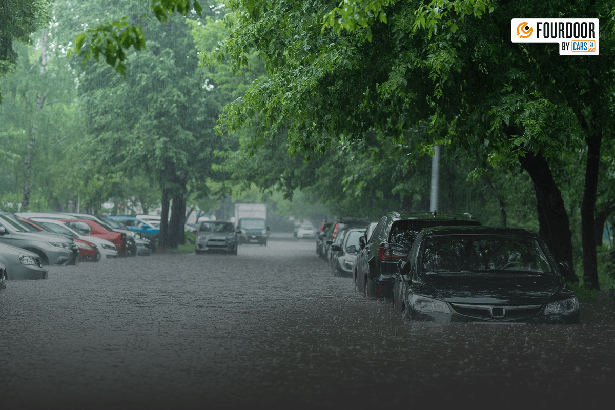 Car stuck in rain flooded road